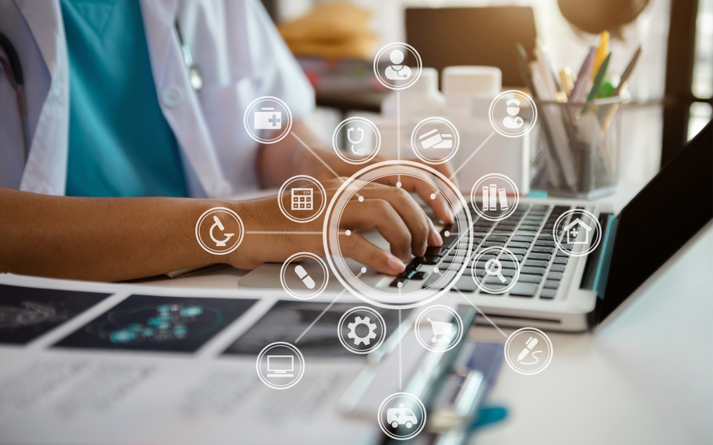 Doctor working on laptop computer and medical stethoscope on clipboard on desk, electronics medical record system EMRs concept