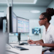 Hospital Doctor Using Spreadsheet For Billing Codes On Desktop