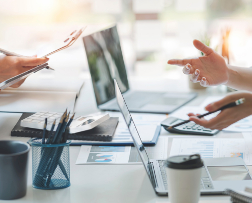 diverse coworkers working together in boardroom